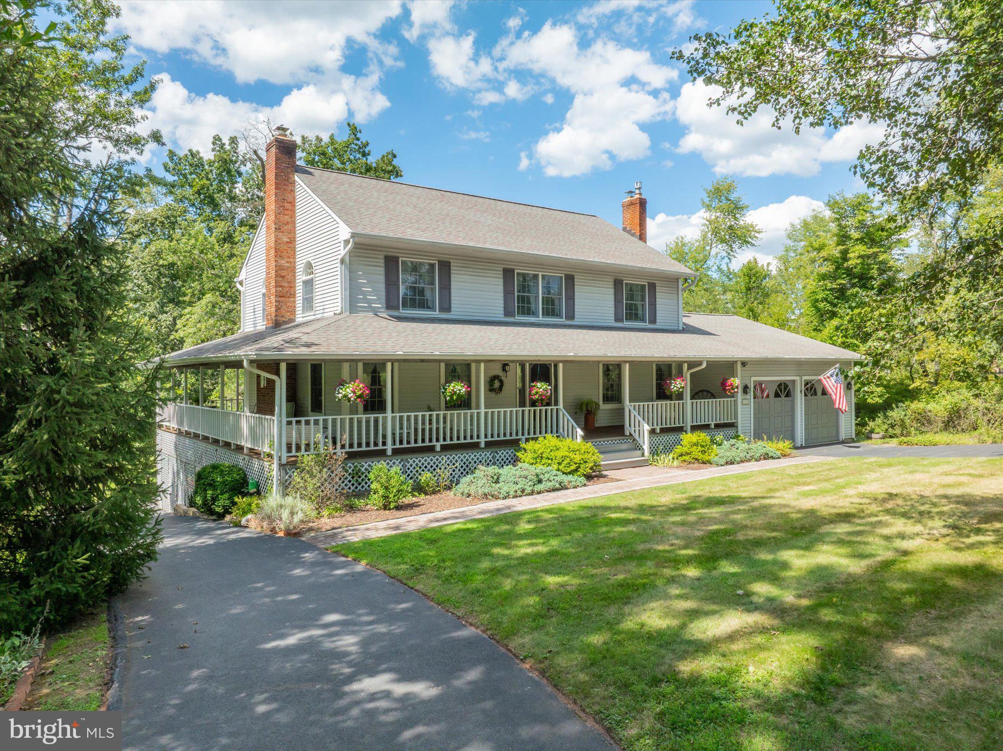 1655 Kriebel Mill Road Collegeville, PA 19426 - Photo 1 of 57 a front view of a house with garden