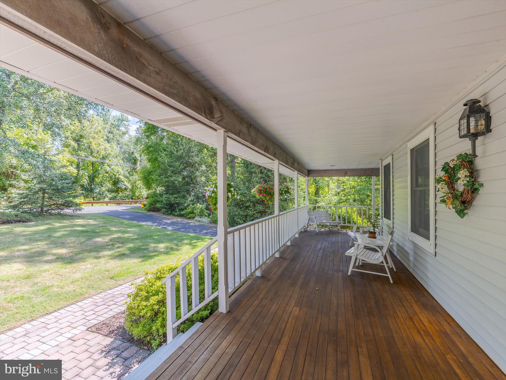 1655 Kriebel Mill Road Collegeville, PA 19426 - Photo 14 of 57 a view of deck with furniture and garden