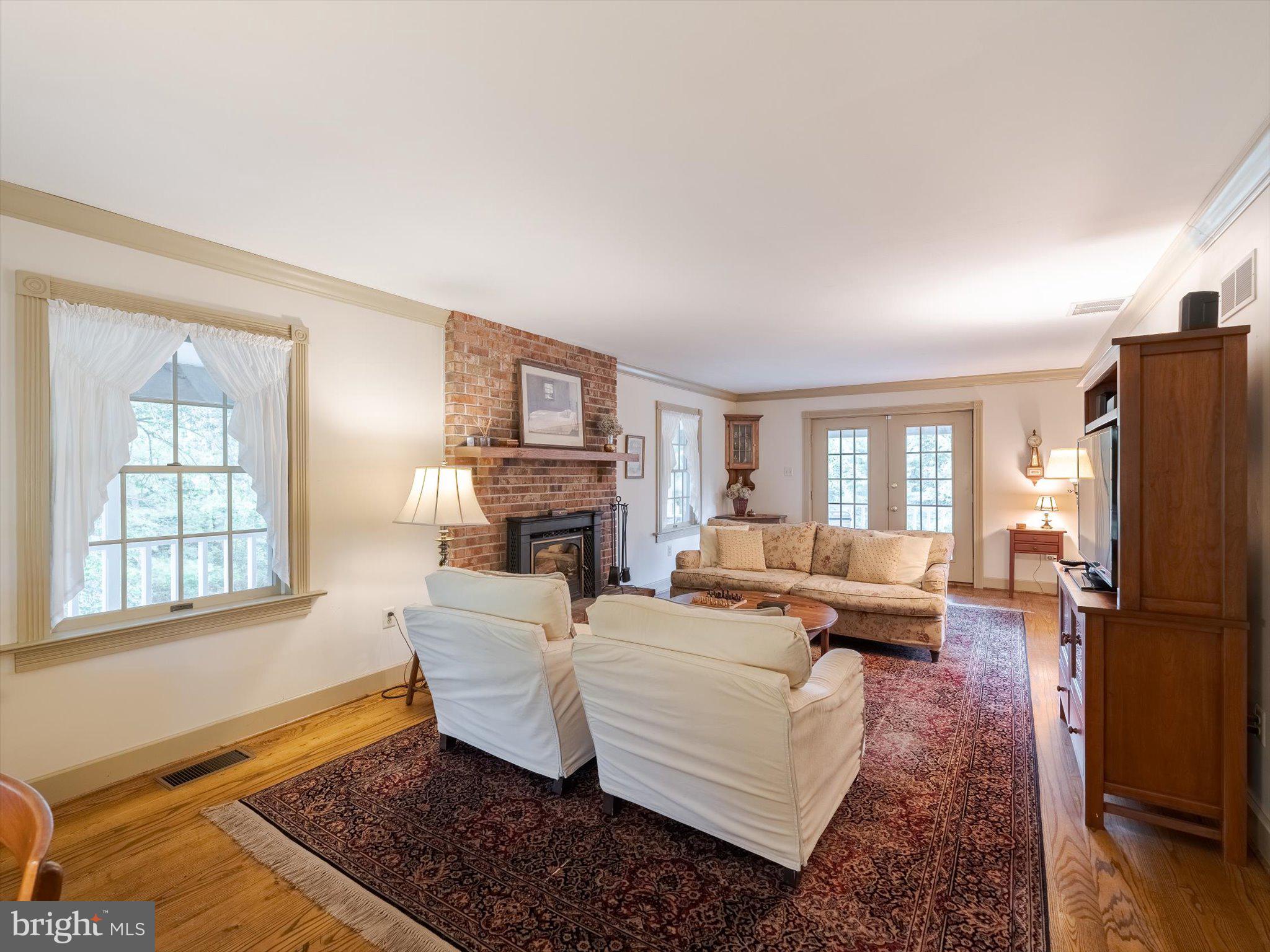 1655 Kriebel Mill Road Collegeville, PA 19426 - Photo 20 of 57 a living room with furniture windows and a fireplace