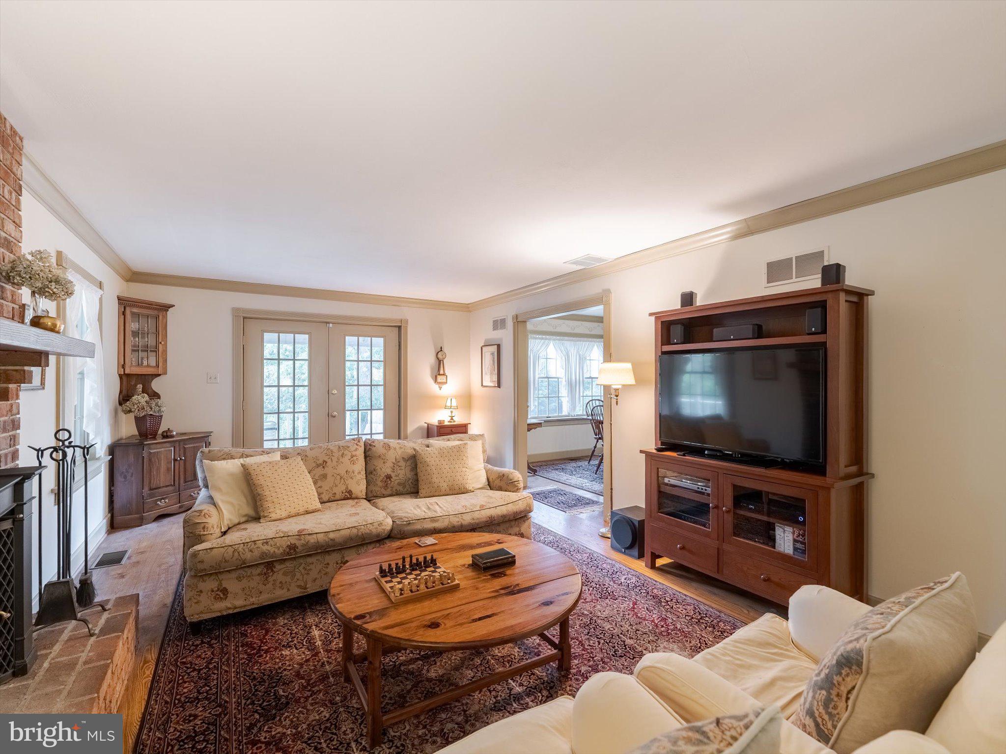1655 Kriebel Mill Road Collegeville, PA 19426 - Photo 22 of 57 a living room with furniture and a flat screen tv