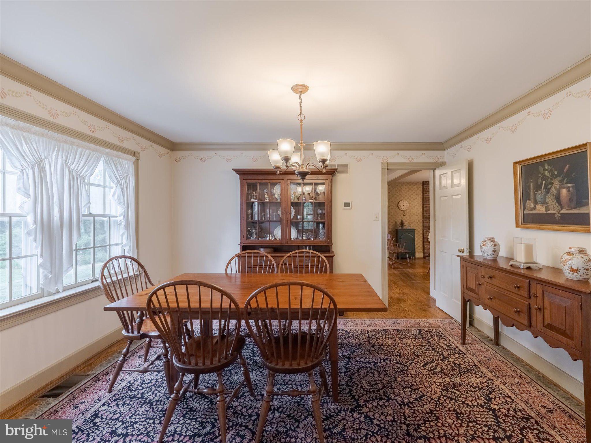 1655 Kriebel Mill Road Collegeville, PA 19426 - Photo 23 of 57 a dining room with furniture a chandelier and window