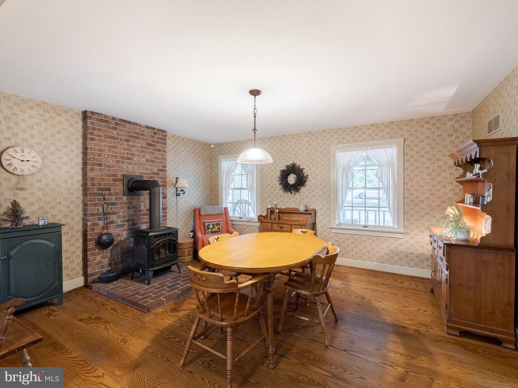 1655 Kriebel Mill Road Collegeville, PA 19426 - Photo 29 of 57 a dining room with furniture a chandelier and wooden floor