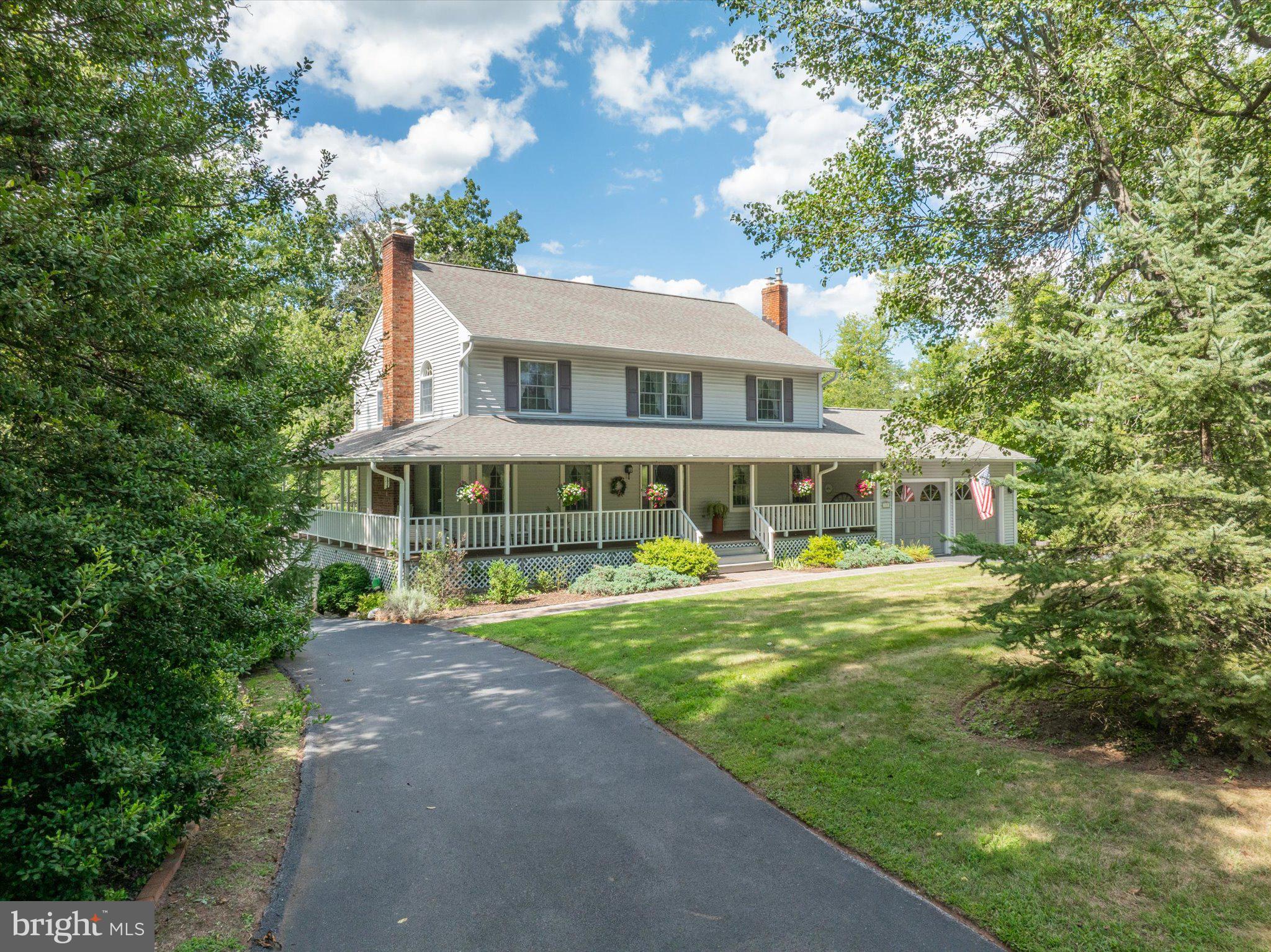 1655 Kriebel Mill Road Collegeville, PA 19426 - Photo 3 of 57 a front view of a house with a garden