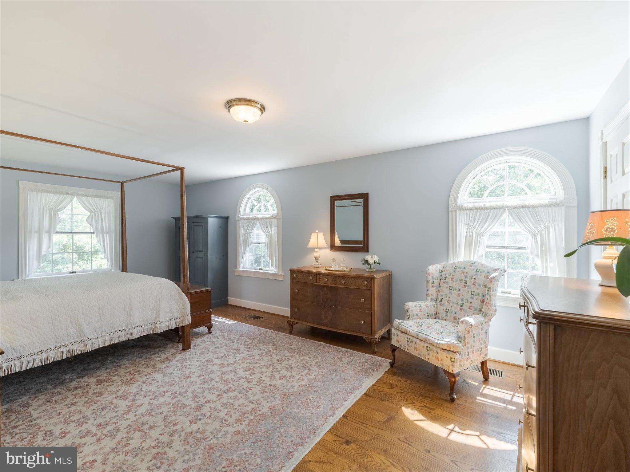 1655 Kriebel Mill Road Collegeville, PA 19426 - Photo 34 of 57 a bedroom with a bed and wooden floor