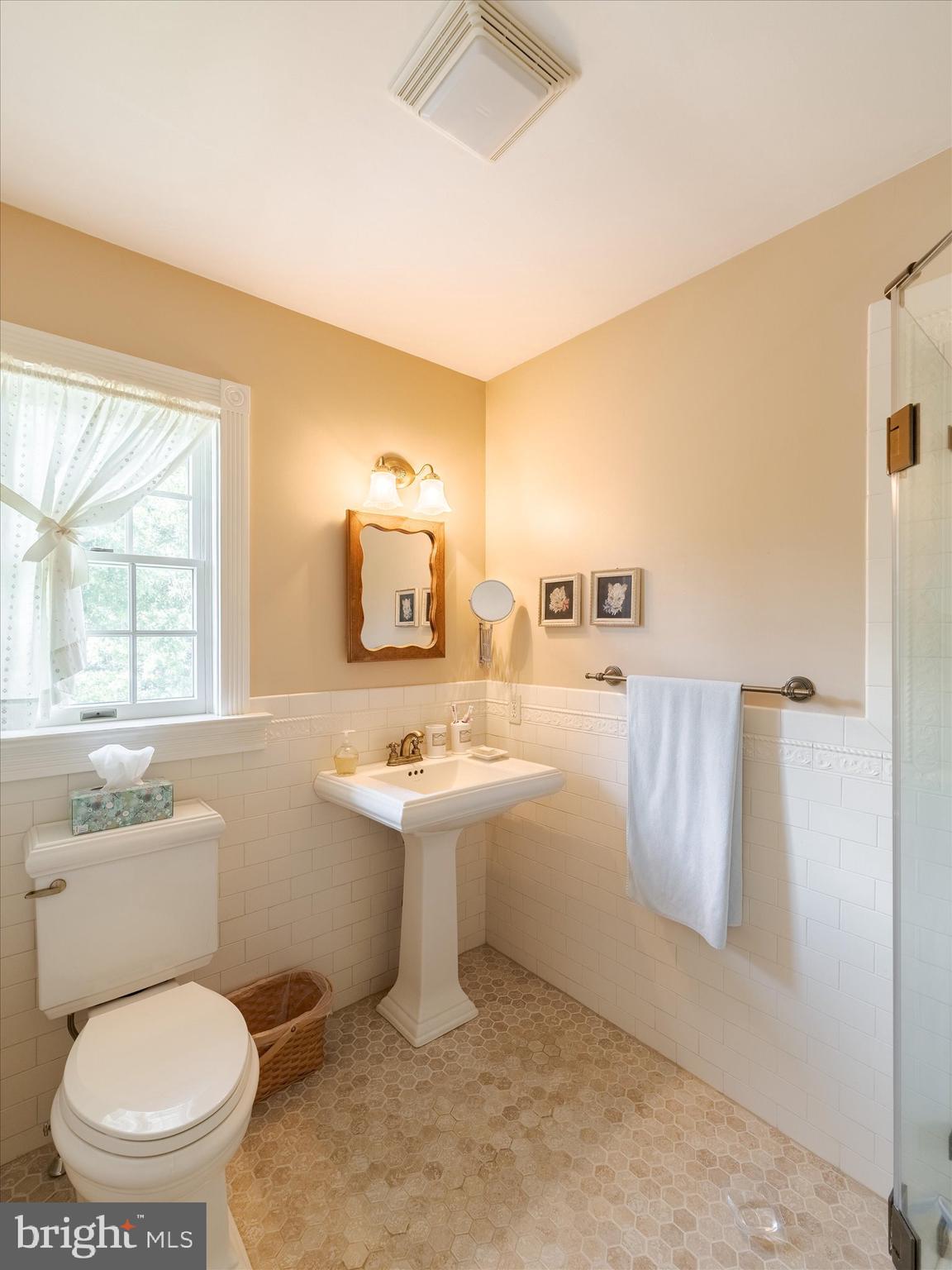 1655 Kriebel Mill Road Collegeville, PA 19426 - Photo 38 of 57 a bathroom with a toilet sink and mirror