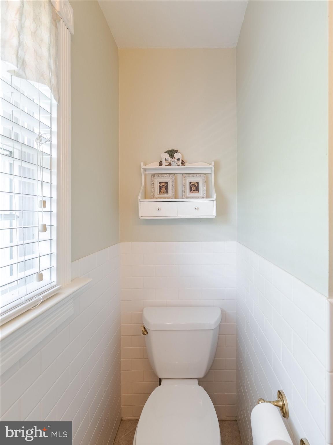 1655 Kriebel Mill Road Collegeville, PA 19426 - Photo 40 of 57 a white toilet sitting next to a small window