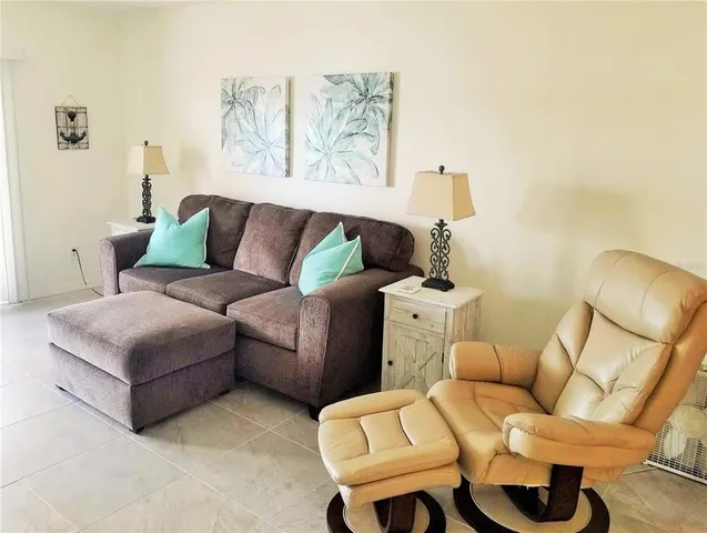 a living room with furniture and a couch