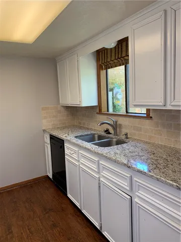 a stove top oven sitting inside of a kitchen