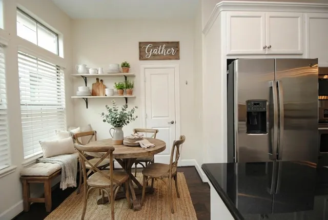 a bathroom with a sink mirror and toilet