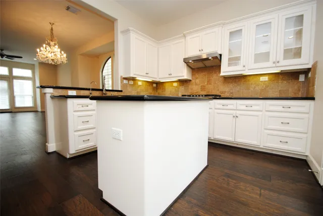 a kitchen with a sink and cabinets