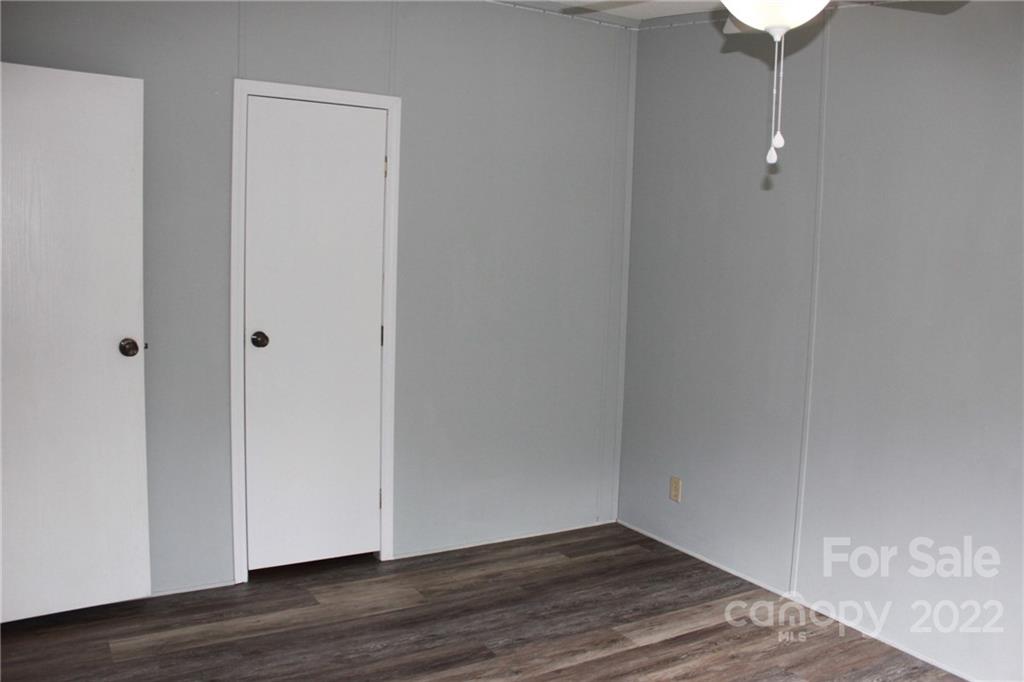 339 Dewitt Owens Road Rutherfordton, NC 28139 - Photo 18 of 48 a view of a small space with wooden floor and a window