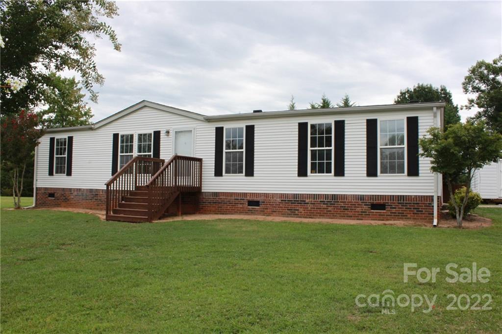 339 Dewitt Owens Road Rutherfordton, NC 28139 - Photo 2 of 48 a front view of a house with a yard
