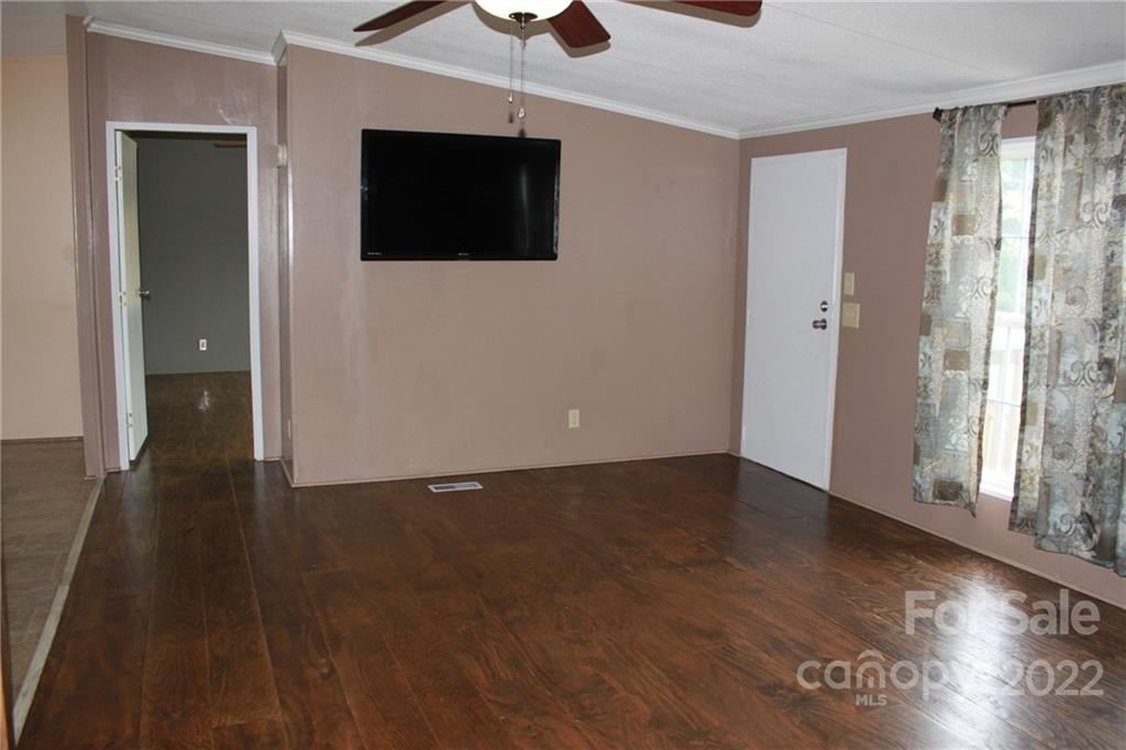 339 Dewitt Owens Road Rutherfordton, NC 28139 - Photo 21 of 48 an empty room with wooden floor and windows