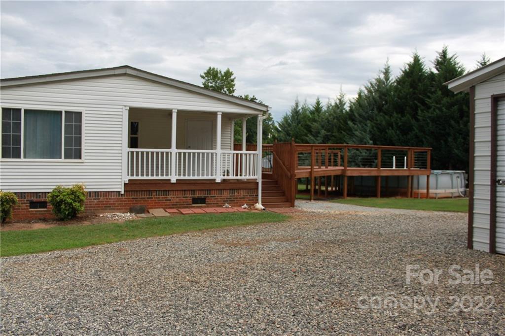 339 Dewitt Owens Road Rutherfordton, NC 28139 - Photo 3 of 48 a backyard of a house with barbeque oven