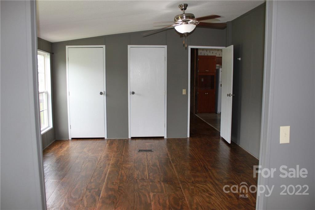 339 Dewitt Owens Road Rutherfordton, NC 28139 - Photo 33 of 48 a view of an empty room with wooden floor and a window