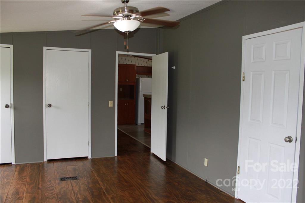 339 Dewitt Owens Road Rutherfordton, NC 28139 - Photo 34 of 48 a view of an empty room with wooden floor and a window