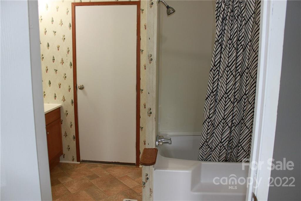 339 Dewitt Owens Road Rutherfordton, NC 28139 - Photo 36 of 48 a bathroom with a shower and a door