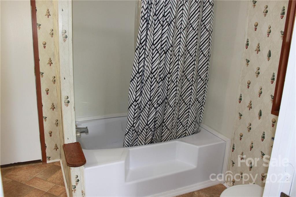 339 Dewitt Owens Road Rutherfordton, NC 28139 - Photo 38 of 48 a bathroom with a bathtub and shower