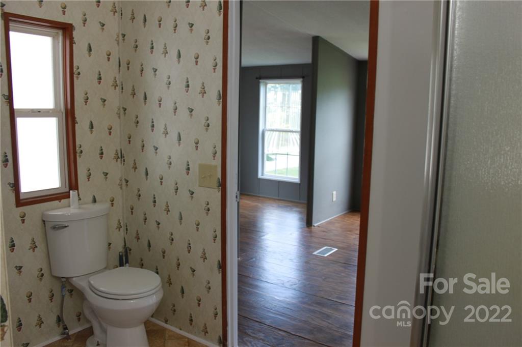 339 Dewitt Owens Road Rutherfordton, NC 28139 - Photo 40 of 48 a bathroom with a toilet and a sink