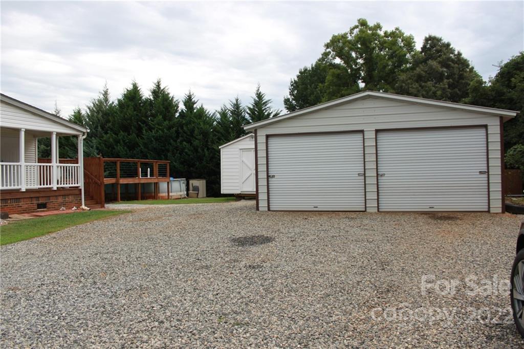 339 Dewitt Owens Road Rutherfordton, NC 28139 - Photo 4 of 48 a front view of house with garage and yard