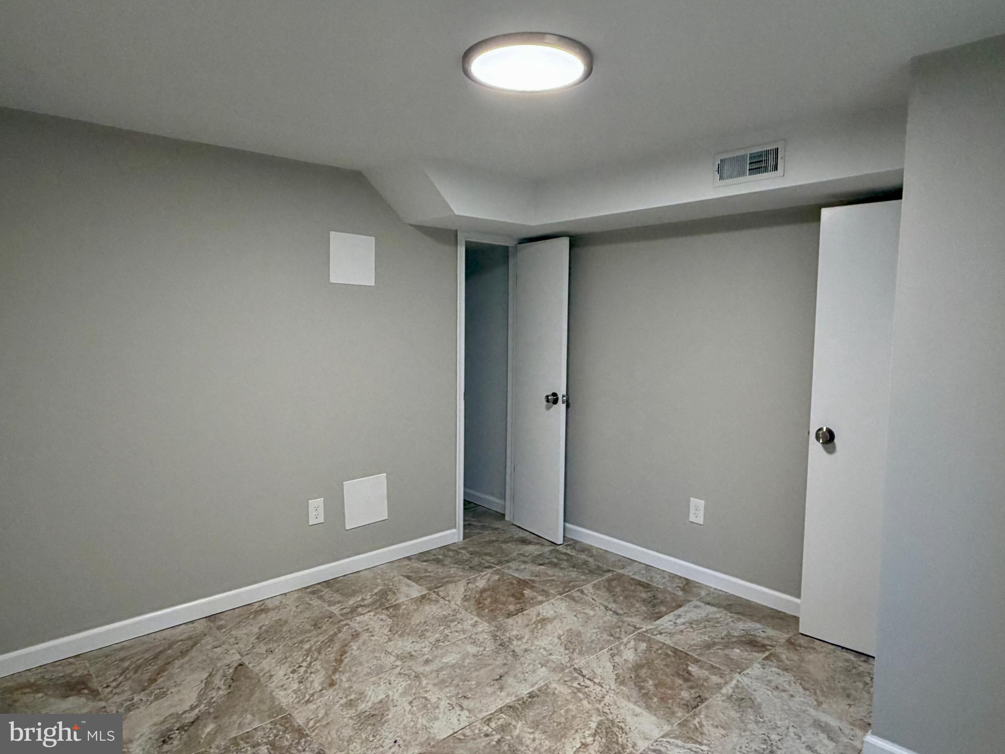 1727 Dallas Street, Unit 1 Philadelphia, PA 19126 - Photo 20 of 25 an empty room with a space