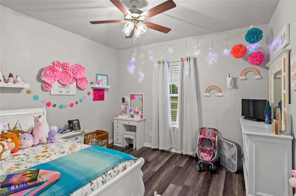 141 Walnut Street Paradise, TX 76073 - Photo 17 of 23 Bedroom with dark wood finished floors and ceiling fan