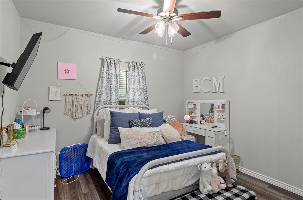 141 Walnut Street Paradise, TX 76073 - Photo 18 of 23 Bedroom featuring dark wood-style flooring and a ceiling fan