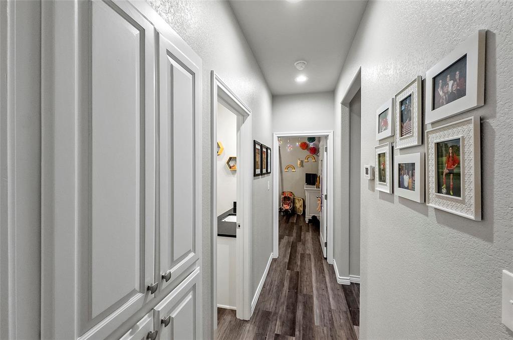 141 Walnut Street Paradise, TX 76073 - Photo 22 of 23 Hall with a textured wall, dark wood-type flooring, and recessed lighting
