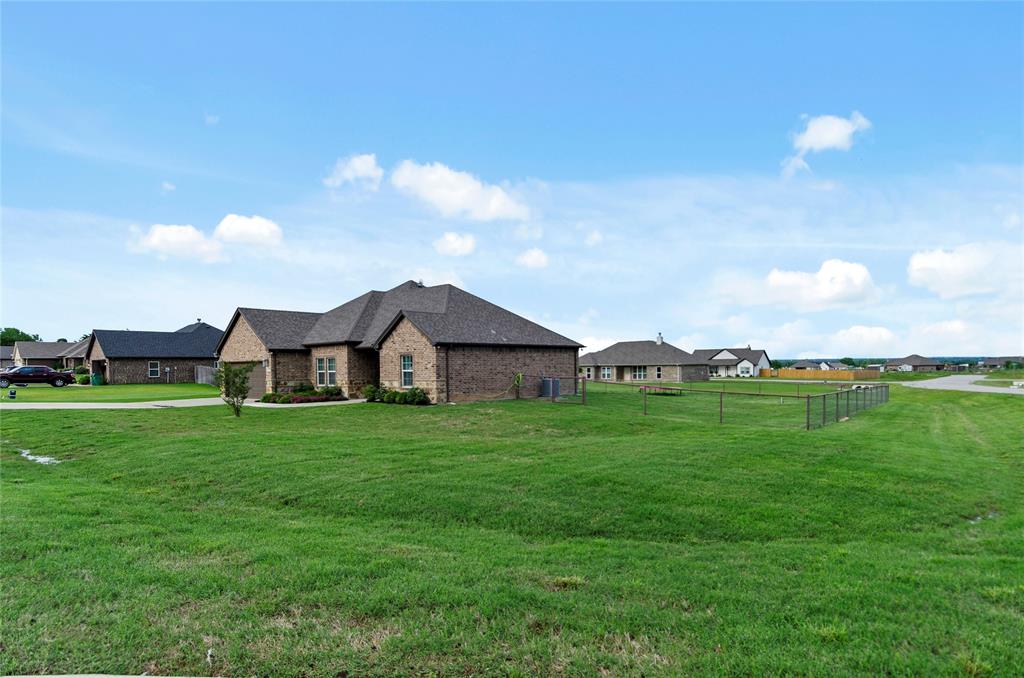 141 Walnut Street Paradise, TX 76073 - Photo 5 of 23 View of home's exterior featuring brick siding