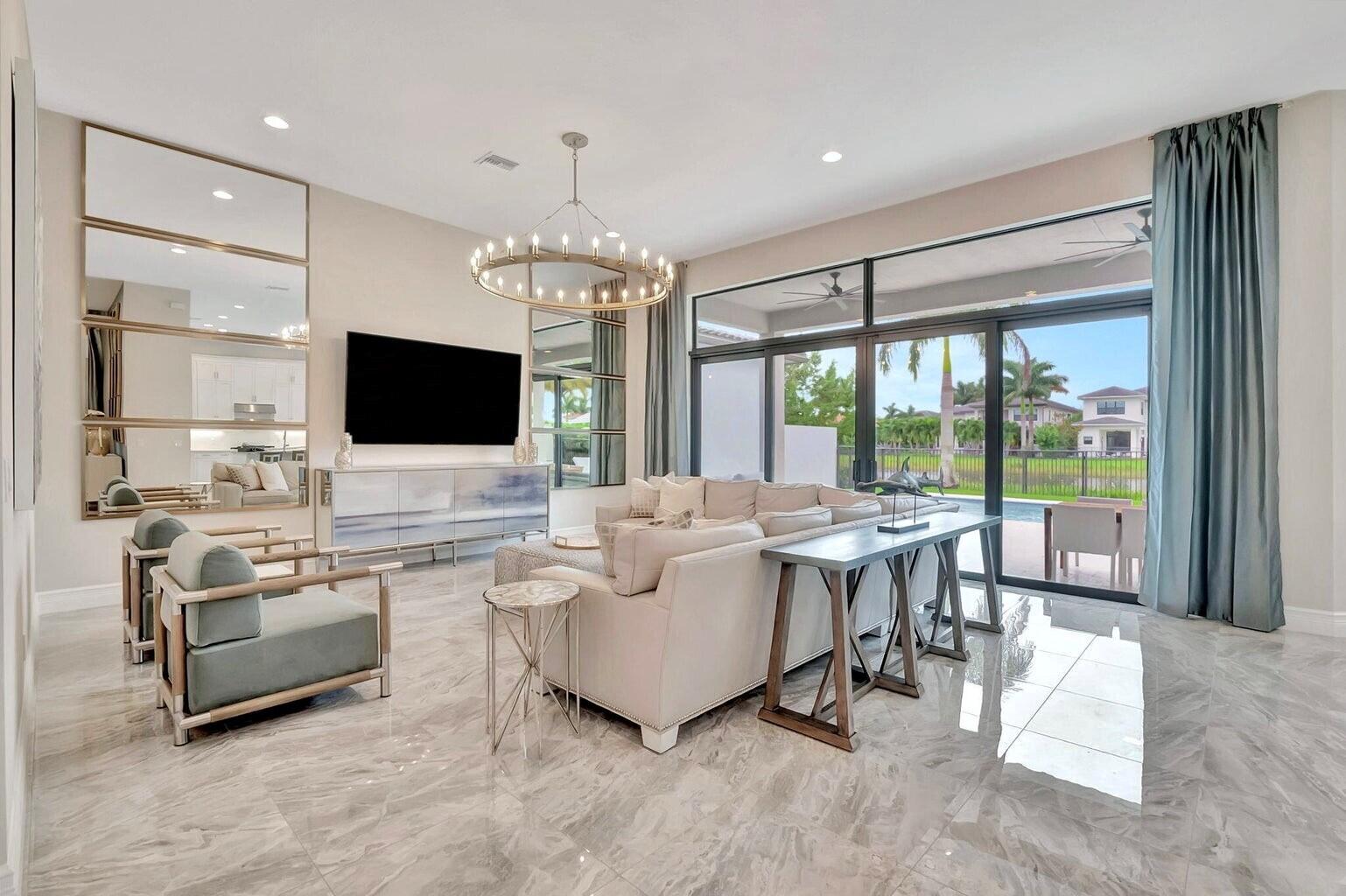 17353 Santaluce Manor Boca Raton, FL 33496 - Photo 8 of 67 a living room with furniture and a flat screen tv