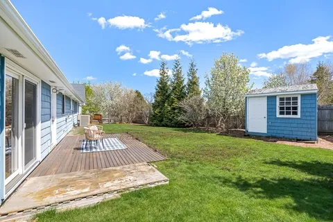 a view of a backyard with garden