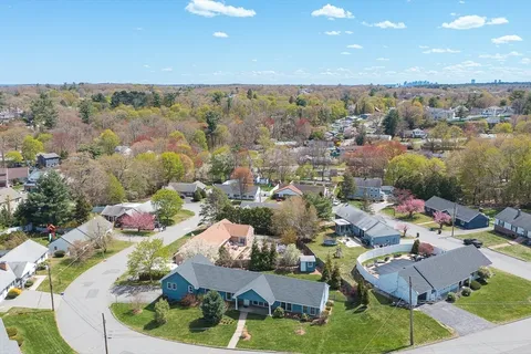 an aerial view of house with yard