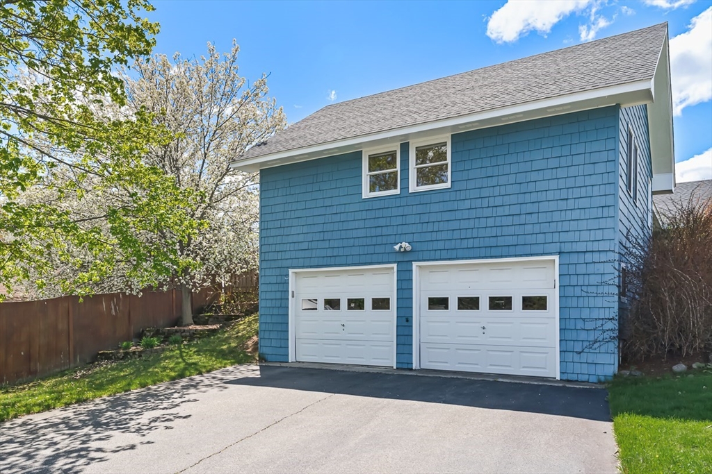 3 Theresa Road Stoneham, MA 02180 - Photo 4 of 42 a front view of a house with a garden