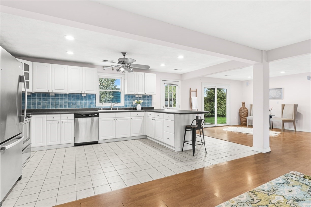 3 Theresa Road Stoneham, MA 02180 - Photo 8 of 42 a large white kitchen with a large window