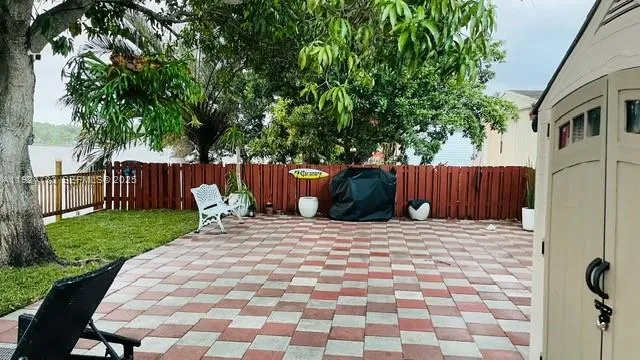 a wooden bench sitting in front of a house