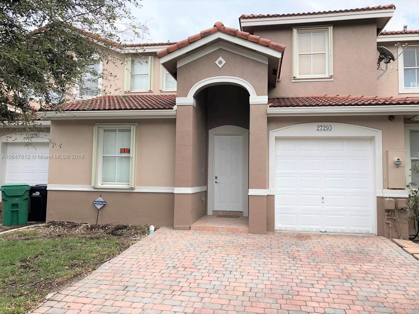 a front view of a house with parking