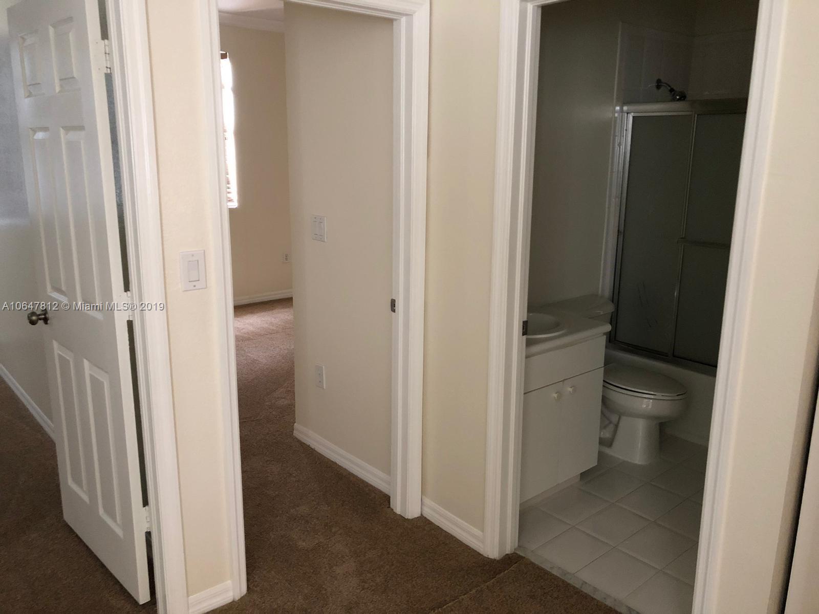 27293 Southwest 138th Path Homestead, FL 33032 - Photo 15 of 19 a view of a bathroom from a hallway