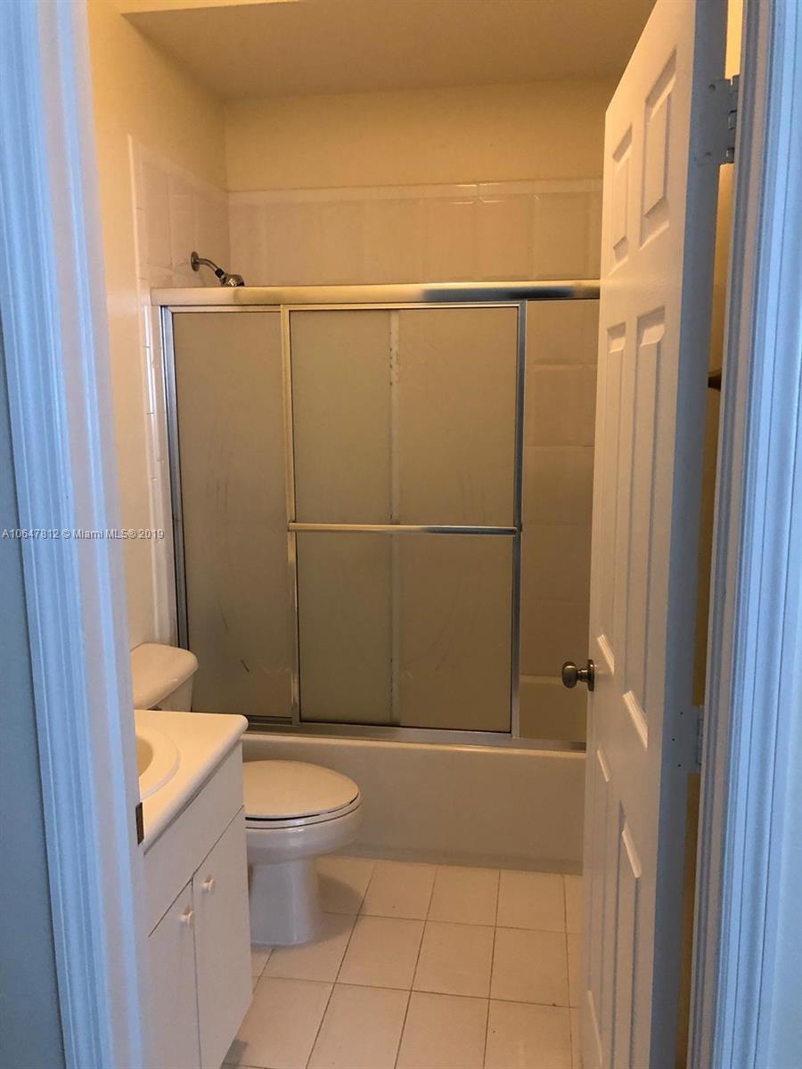 27293 Southwest 138th Path Homestead, FL 33032 - Photo 16 of 19 a bathroom with a granite countertop toilet and a shower