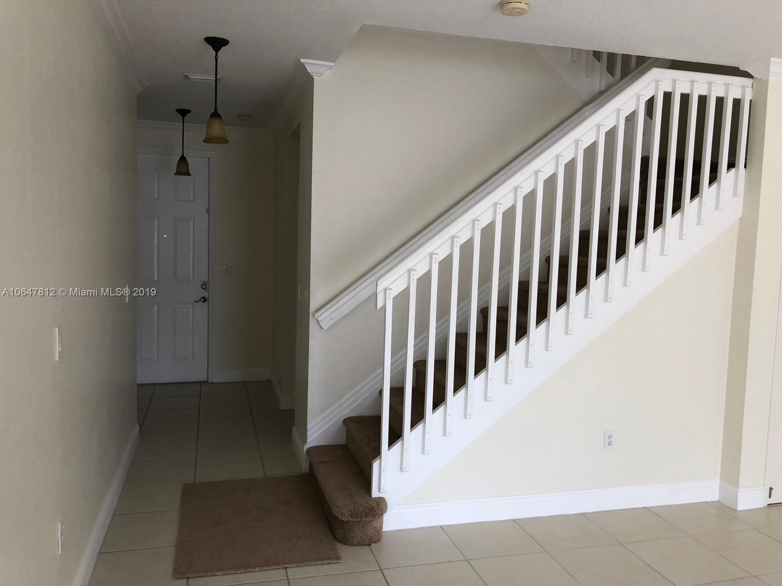 27293 Southwest 138th Path Homestead, FL 33032 - Photo 7 of 19 a view of staircase with railing and white walls