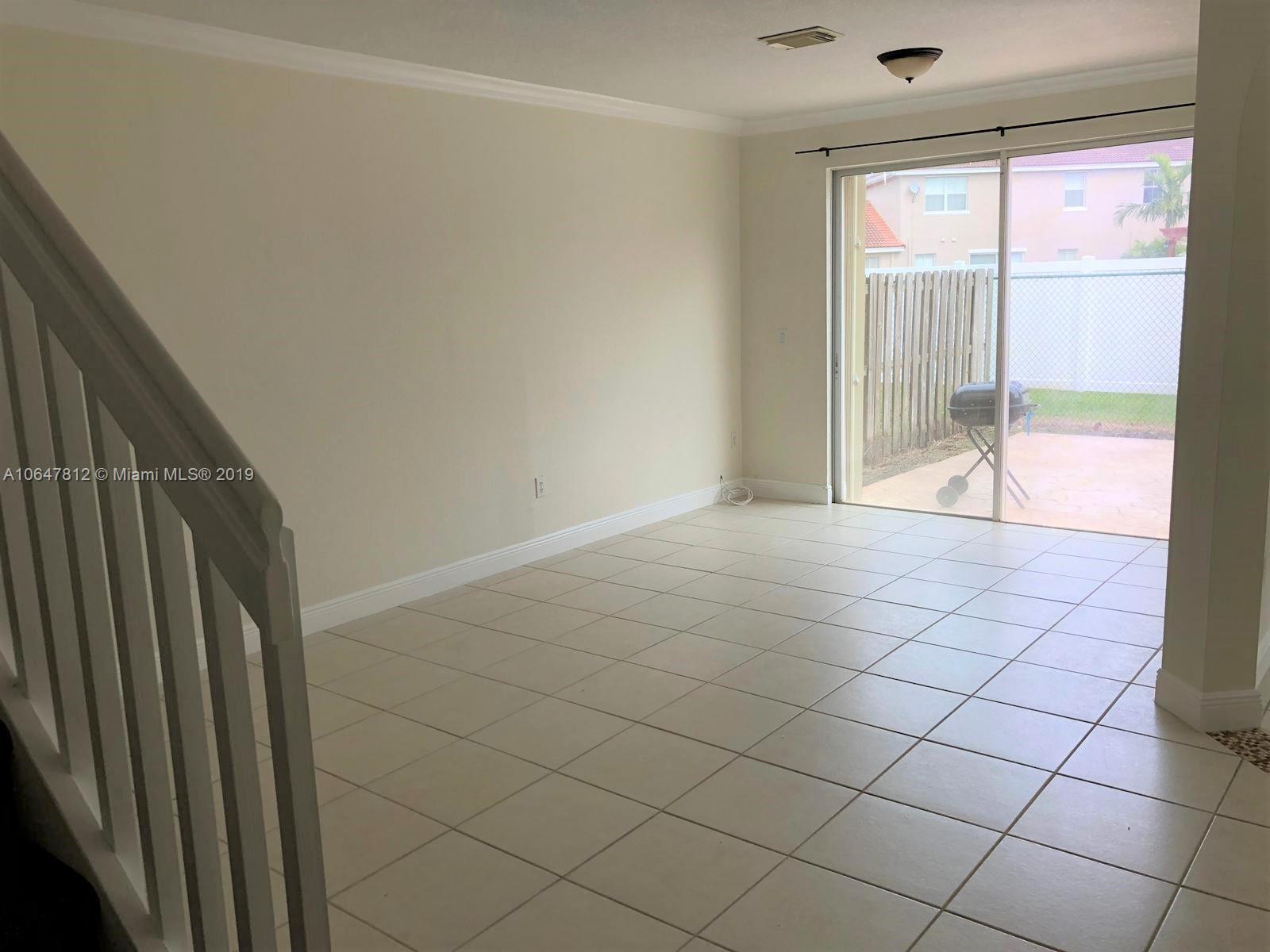27293 Southwest 138th Path Homestead, FL 33032 - Photo 8 of 19 a view of an empty room and window
