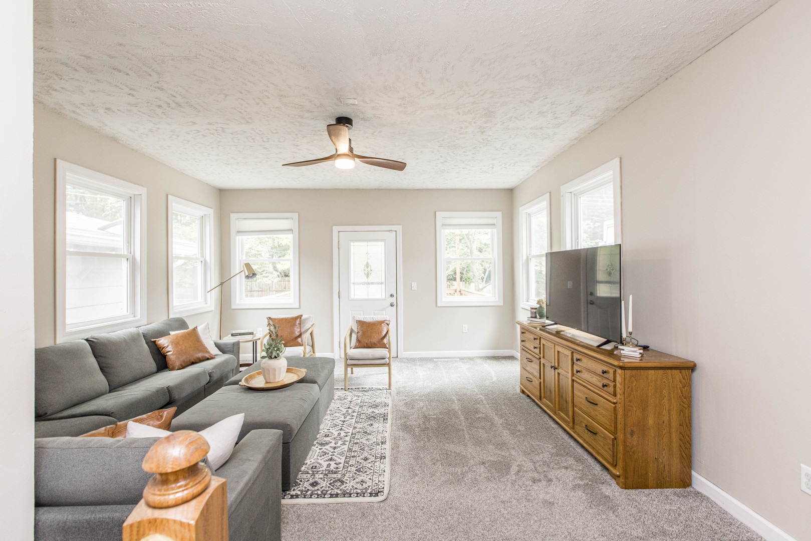 22 Broadway Place Normal, IL 61761 - Photo 13 of 36 a living room with furniture and a flat screen tv