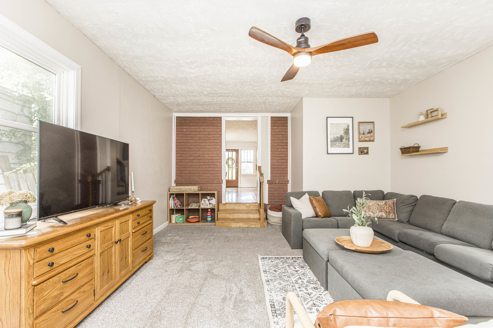 22 Broadway Place Normal, IL 61761 - Photo 16 of 36 a living room with furniture and a flat screen tv