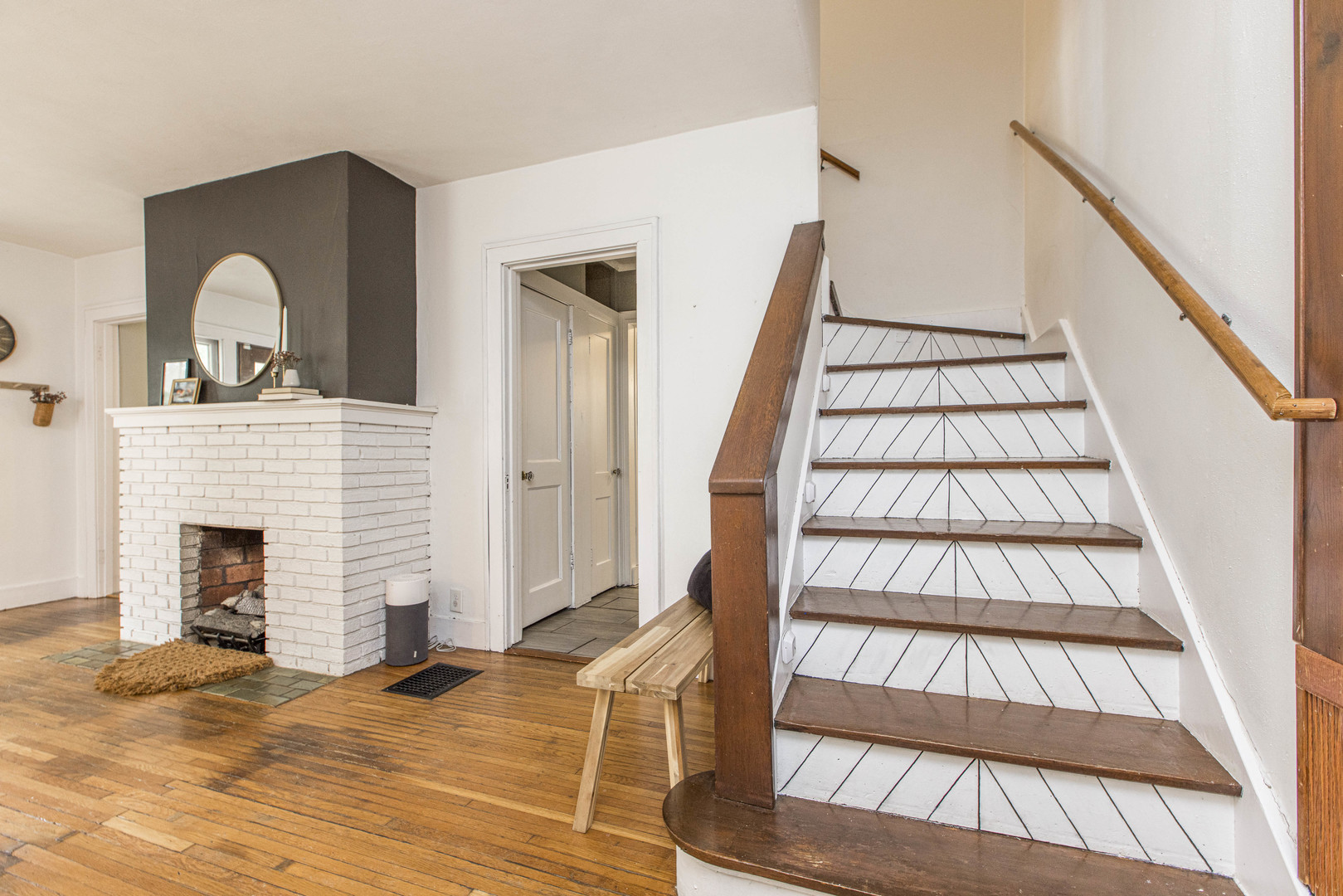 22 Broadway Place Normal, IL 61761 - Photo 17 of 36 a view of staircase with white walls and fireplace