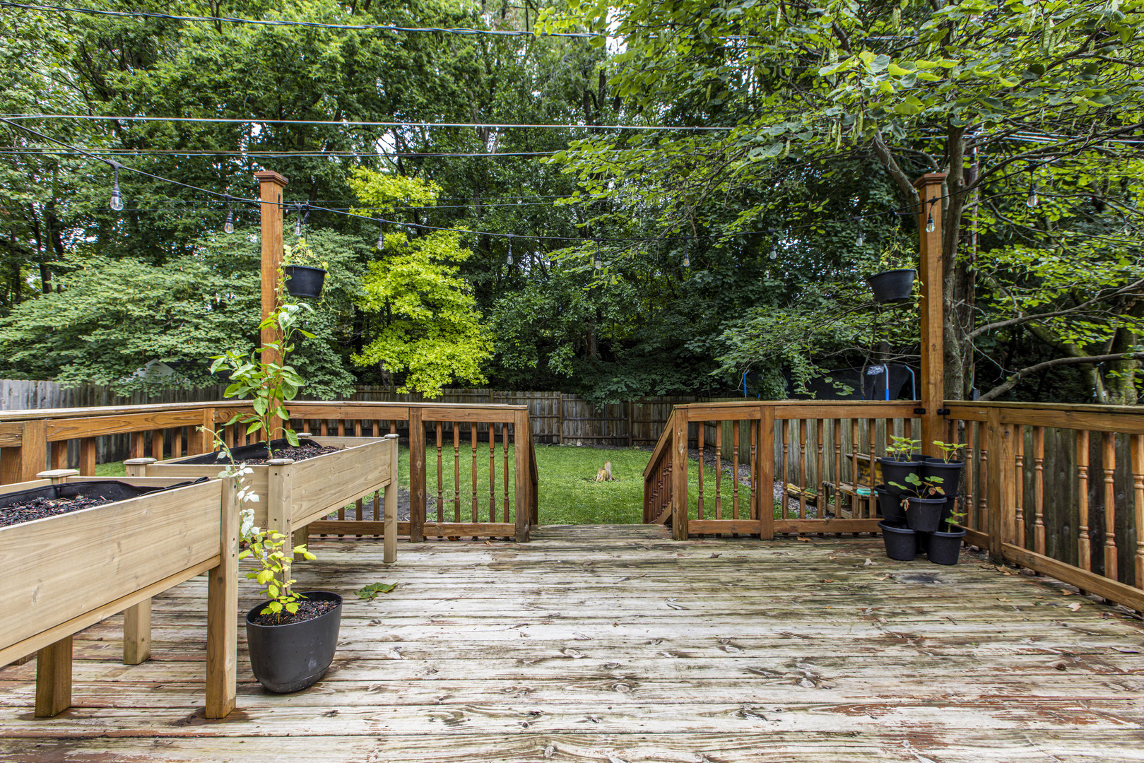 22 Broadway Place Normal, IL 61761 - Photo 27 of 36 a view of a small deck with wooden floor and fence