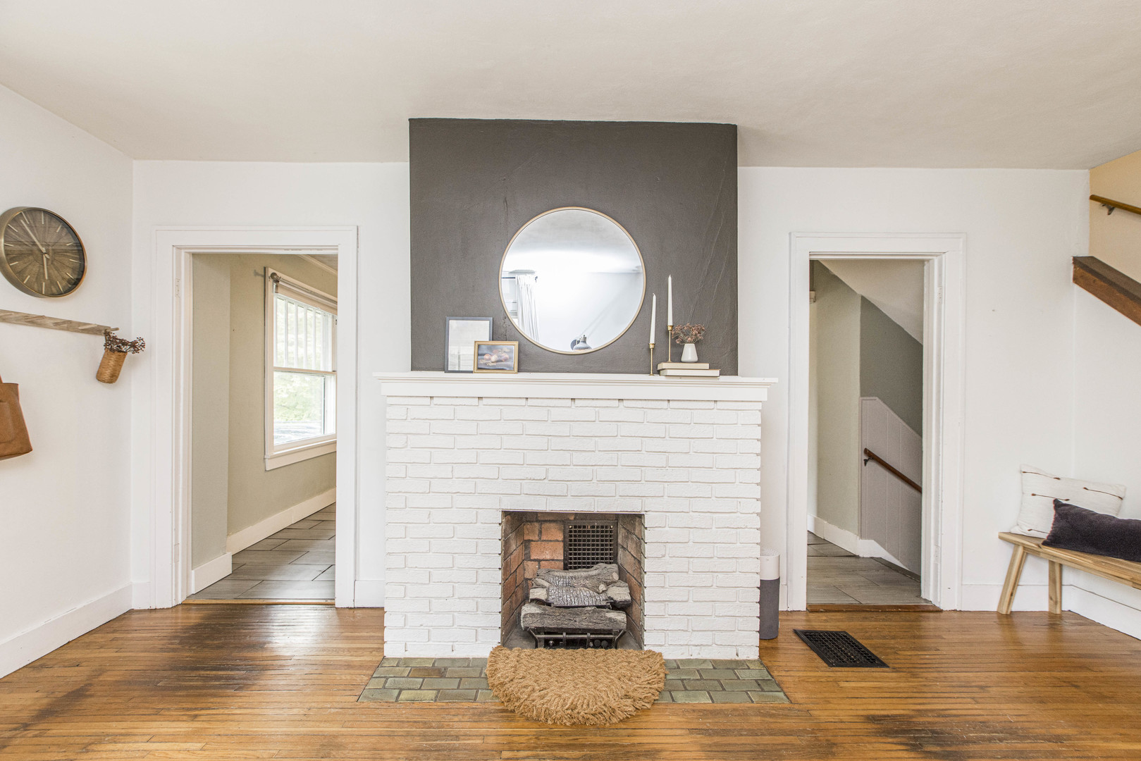 22 Broadway Place Normal, IL 61761 - Photo 7 of 36 a living room with a fireplace and a wooden floor