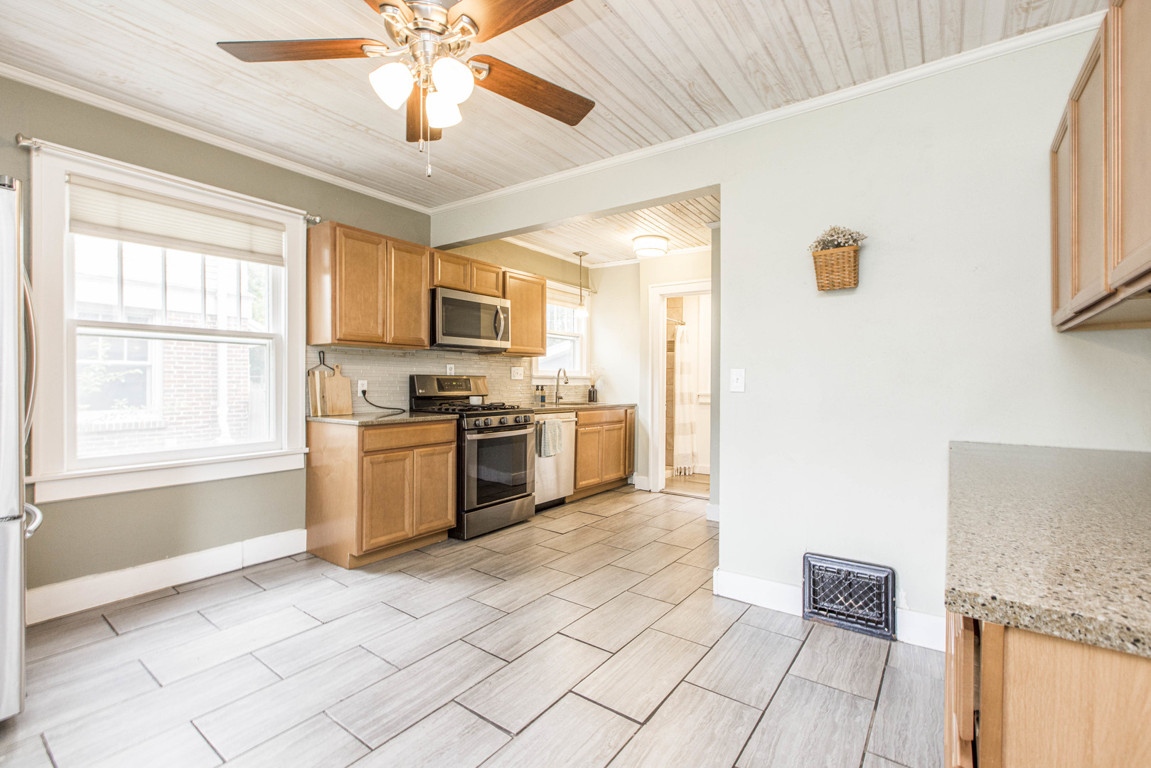 22 Broadway Place Normal, IL 61761 - Photo 8 of 36 a kitchen with granite countertop a refrigerator and a stove top oven