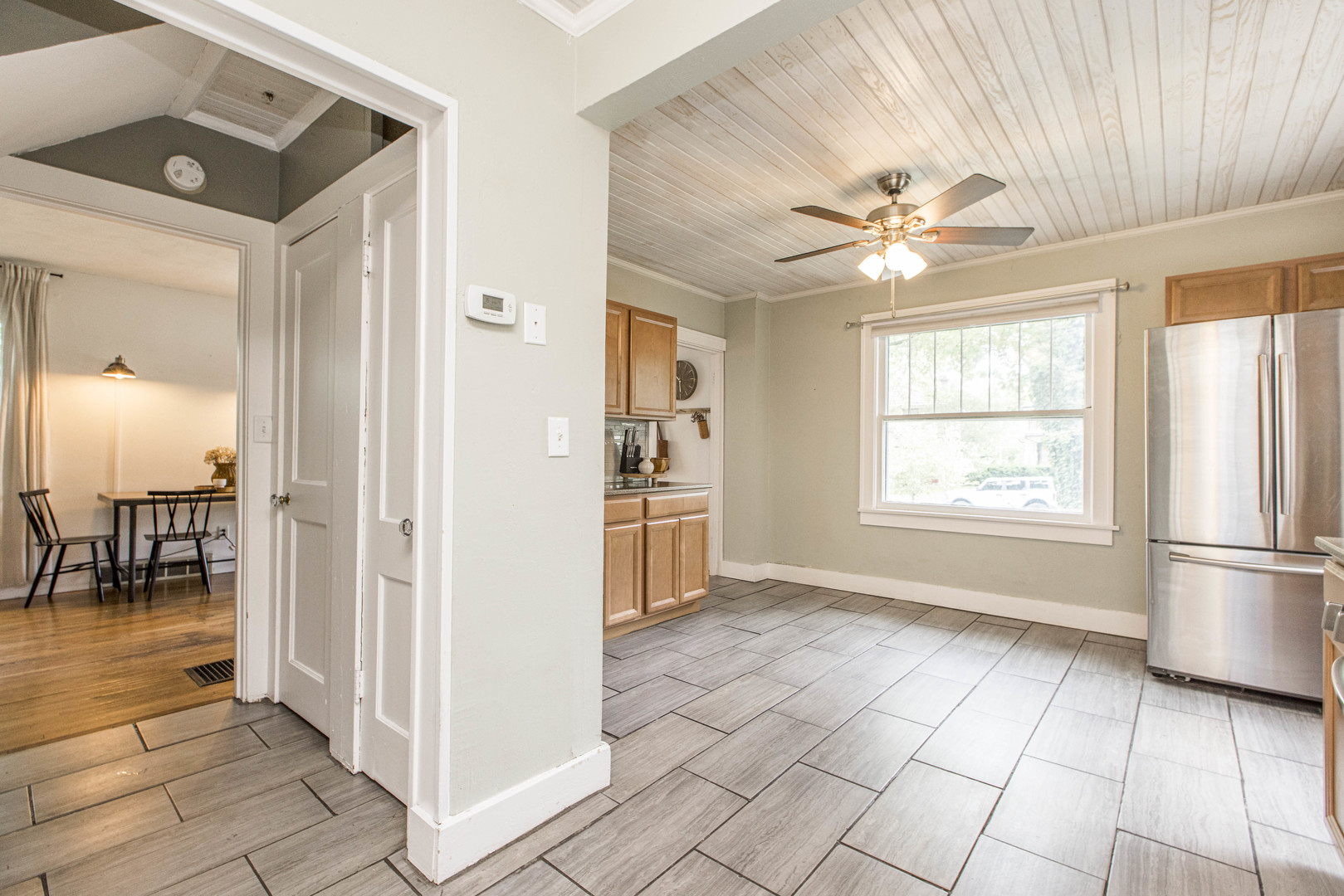 22 Broadway Place Normal, IL 61761 - Photo 9 of 36 an empty room with windows and chandelier fan