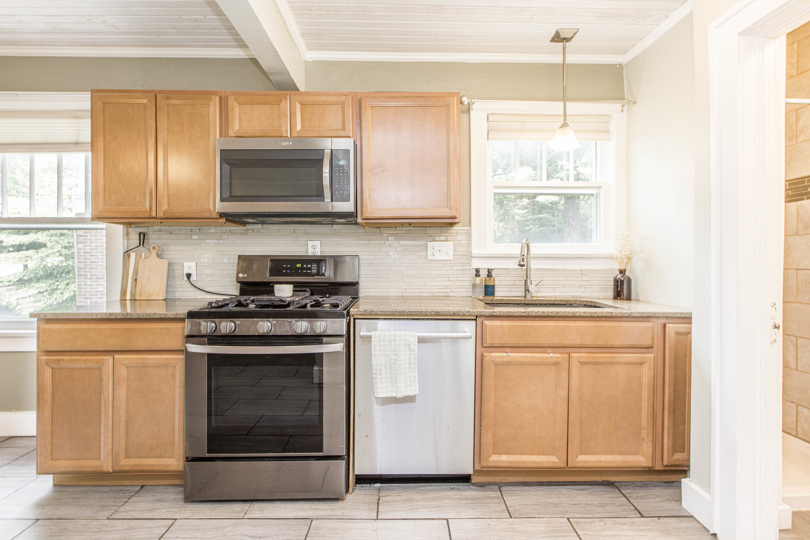 22 Broadway Place Normal, IL 61761 - Photo 10 of 36 a kitchen with stainless steel appliances granite countertop a stove a sink and a microwave