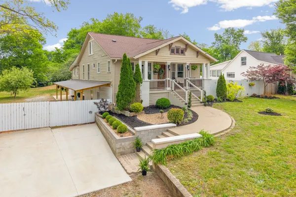 a kitchen with stainless steel appliances granite countertop a sink a stove and a microwave