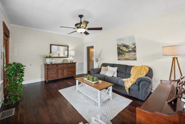 a kitchen with stainless steel appliances granite countertop a stove a sink dishwasher a microwave oven with a dining table and chairs